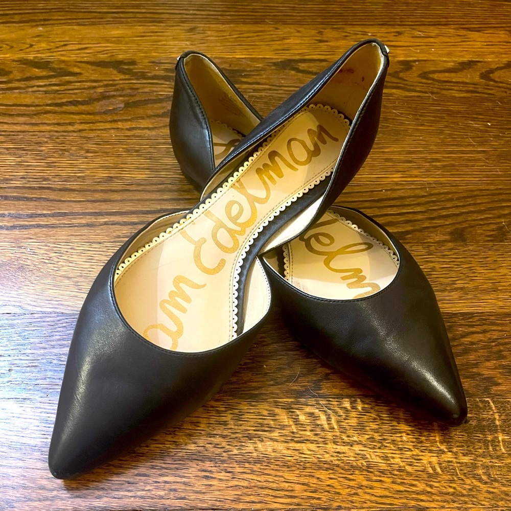 Black leather pointed flats that seem to fit closer to a 9 or 9.5